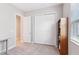 Bedroom featuring closet and neutral carpet at 30764 Lindentree Dr, Wesley Chapel, FL 33543