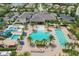 Aerial view of the community pool and slide, with lounge seating, perfect for residents to enjoy the outdoors at 30764 Lindentree Dr, Wesley Chapel, FL 33543