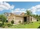 Charming single-story home with a well-manicured lawn, lush landscaping, and a two-car garage, offering great curb appeal at 30764 Lindentree Dr, Wesley Chapel, FL 33543