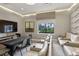 A well-appointed movie room with leather recliners and a large screen TV at 30764 Lindentree Dr, Wesley Chapel, FL 33543