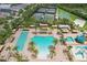 Aerial view of community pool with lap lanes, pool, tennis courts, and basketball court at 30764 Lindentree Dr, Wesley Chapel, FL 33543