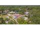 Aerial view of a home with large yard, and mature trees in a well established neighborhood at 311 Jeanal Pl, Tampa, FL 33612