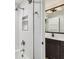 Bathroom featuring shower over tub, decorative tile, and natural light at 3209 W Morrison Ave, Tampa, FL 33629
