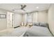 Bedroom with plush carpet, neutral paint, natural light, and ceiling fan at 3209 W Morrison Ave, Tampa, FL 33629