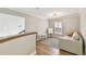 Bright bonus room features hardwood floors, neutral paint, natural light, and comfortable sitting area at 3209 W Morrison Ave, Tampa, FL 33629