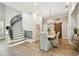 Dining room with staircase, chandelier, and wood floors at 3209 W Morrison Ave, Tampa, FL 33629