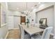 Dining room with hardwood floors, chandelier, and decorative mirror at 3209 W Morrison Ave, Tampa, FL 33629