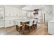 Spacious kitchen with a large island, white cabinets, and hardwood floors at 3209 W Morrison Ave, Tampa, FL 33629
