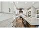 Gourmet kitchen with white cabinets, marble countertops, and stainless steel appliances at 3209 W Morrison Ave, Tampa, FL 33629