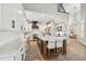 Bright kitchen featuring an island with chairs, white cabinets, and modern appliances at 3209 W Morrison Ave, Tampa, FL 33629