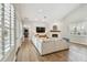 Living room with white brick fireplace, adjacent to french doors and a TV, perfect for relaxing at 3209 W Morrison Ave, Tampa, FL 33629