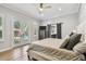 Bright main bedroom with access to the backyard, a sliding barn door, and natural light at 3209 W Morrison Ave, Tampa, FL 33629