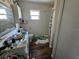 Bathroom view featuring a toilet, shower, sink, and window at 32348 Marchmont Cir, Dade City, FL 33523