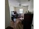 Modest bedroom with ceiling fan, and a window bringing in natural light at 32348 Marchmont Cir, Dade City, FL 33523