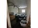 This bedroom features a ceiling fan and a window, ready for renovation to create a relaxing retreat at 32348 Marchmont Cir, Dade City, FL 33523