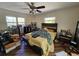 Bedroom with natural light, a ceiling fan, and modern furniture at 32348 Marchmont Cir, Dade City, FL 33523
