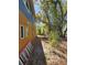 Side view of a house, with large trees in the background at 32348 Marchmont Cir, Dade City, FL 33523