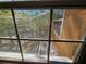 Exterior view from the window with a screened-in deck and lake at 32348 Marchmont Cir, Dade City, FL 33523