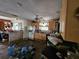 This kitchen features wooden cabinets, fan, and breakfast bar, ready for renovation to create a dream space at 32348 Marchmont Cir, Dade City, FL 33523