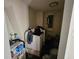 Laundry room featuring a washing machine and wire shelving storage at 32348 Marchmont Cir, Dade City, FL 33523