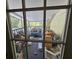 Enclosed porch featuring outdoor seating, screen windows, and ample space for relaxation at 32348 Marchmont Cir, Dade City, FL 33523