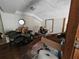 Upstairs room with white walls, dormers, and space for storage at 32348 Marchmont Cir, Dade City, FL 33523
