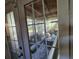Sunroom viewed through glass doors at 32348 Marchmont Cir, Dade City, FL 33523