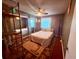 Cozy bedroom featuring dark walls, sliding closet doors, and palm tree themed rug at 3338 Fernleaf Dr, Hernando Beach, FL 34607