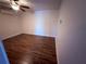 Serene bedroom features new wood-look floors and a modern ceiling fan and air conditioning unit at 3338 Fernleaf Dr, Hernando Beach, FL 34607