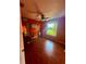 Bedroom featuring laminate flooring, a ceiling fan, and a window with a pleasant view at 3338 Fernleaf Dr, Hernando Beach, FL 34607