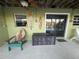 Inviting covered patio with serene water view provides a relaxing space for outdoor entertainment and enjoying tranquil surroundings at 3338 Fernleaf Dr, Hernando Beach, FL 34607