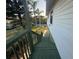 Exterior stairs leading to the ground with a partial view of the surrounding landscaping at 3338 Fernleaf Dr, Hernando Beach, FL 34607