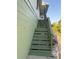 View of the exterior stairs leading up to the side entrance of the home at 3338 Fernleaf Dr, Hernando Beach, FL 34607