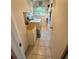 Functional laundry room with a washer, utility sink, ample storage, and natural light at 3338 Fernleaf Dr, Hernando Beach, FL 34607