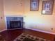 Living room with a fireplace, tropical themed decor, and dark hardwood floor at 3338 Fernleaf Dr, Hernando Beach, FL 34607