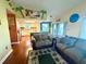 Bright and open living room featuring vaulted ceilings and a seamless connection to the kitchen at 3338 Fernleaf Dr, Hernando Beach, FL 34607