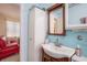 Cozy bathroom features a decorative mirror and vanity sink at 3405 E Diana St, Tampa, FL 33610