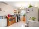 Well-lit kitchen featuring tiled floors, neutral walls, and window with plants at 3405 E Diana St, Tampa, FL 33610