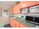 Kitchen features tile floor, ample storage, and modern appliances at 3405 E Diana St, Tampa, FL 33610