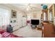Bright living room showcasing neutral carpet, ceiling fan and doorway to another room at 3405 E Diana St, Tampa, FL 33610