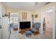 Open living room with a view into a room with a bed and tiled doorway at 3405 E Diana St, Tampa, FL 33610