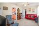 Inviting living room boasting neutral walls, ceiling fan, and open doorway to kitchen at 3405 E Diana St, Tampa, FL 33610
