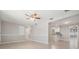 Spacious living room with neutral paint, tile floors, crown molding, and ample natural light at 3445 Pinehurst Dr, Holiday, FL 34691