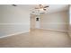 Spacious living room featuring tile floors, neutral paint, and abundant natural light at 3445 Pinehurst Dr, Holiday, FL 34691