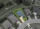 Aerial view shows a beautifully landscaped single Gathering home with a large driveway and well-maintained lawn at 34652 Heavenly Ln, Dade City, FL 33525