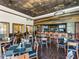 A stylish bar with wood paneling and seating is available in the community clubhouse at 34652 Heavenly Ln, Dade City, FL 33525