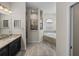 This bathroom features granite countertops, a tiled shower, and a soaking tub at 34652 Heavenly Ln, Dade City, FL 33525