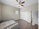 Bedroom boasts wood floors, double closets, and natural light from the window at 34652 Heavenly Ln, Dade City, FL 33525