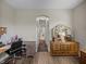 This hallway features arched doorways, neutral paint, and laminate flooring at 34652 Heavenly Ln, Dade City, FL 33525
