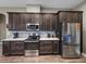 Modern kitchen showcases stainless steel appliances, granite countertops, and ample cabinet space at 34652 Heavenly Ln, Dade City, FL 33525